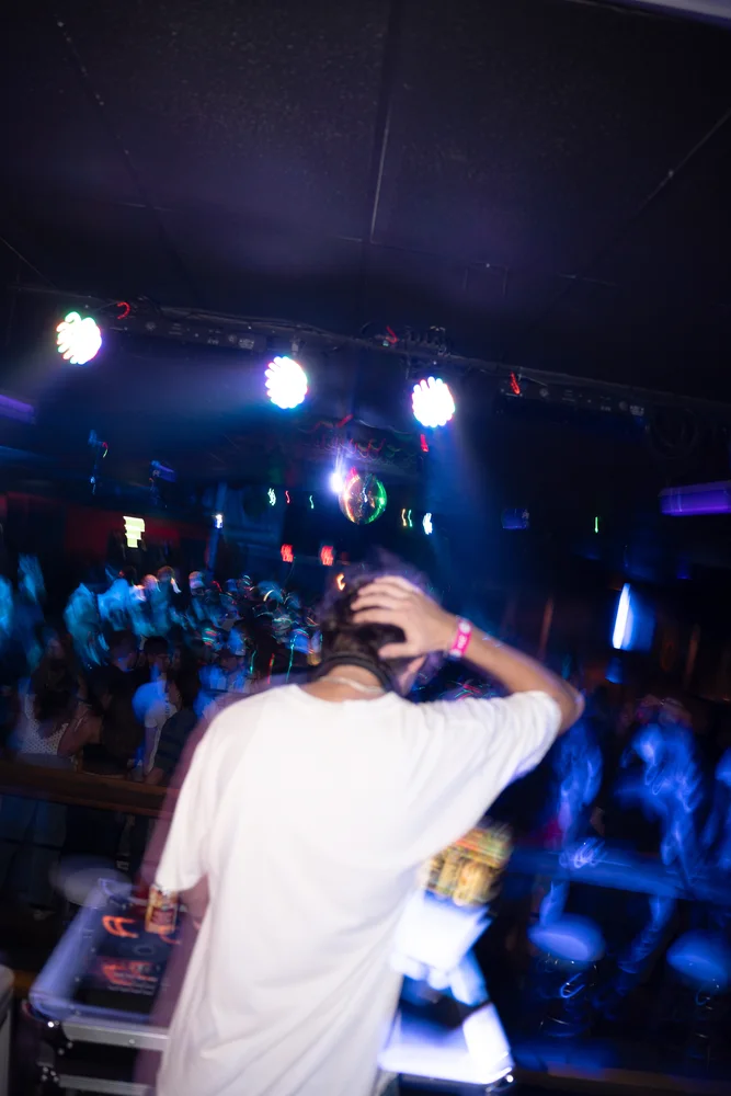 Rear view from the booth under blue room lights