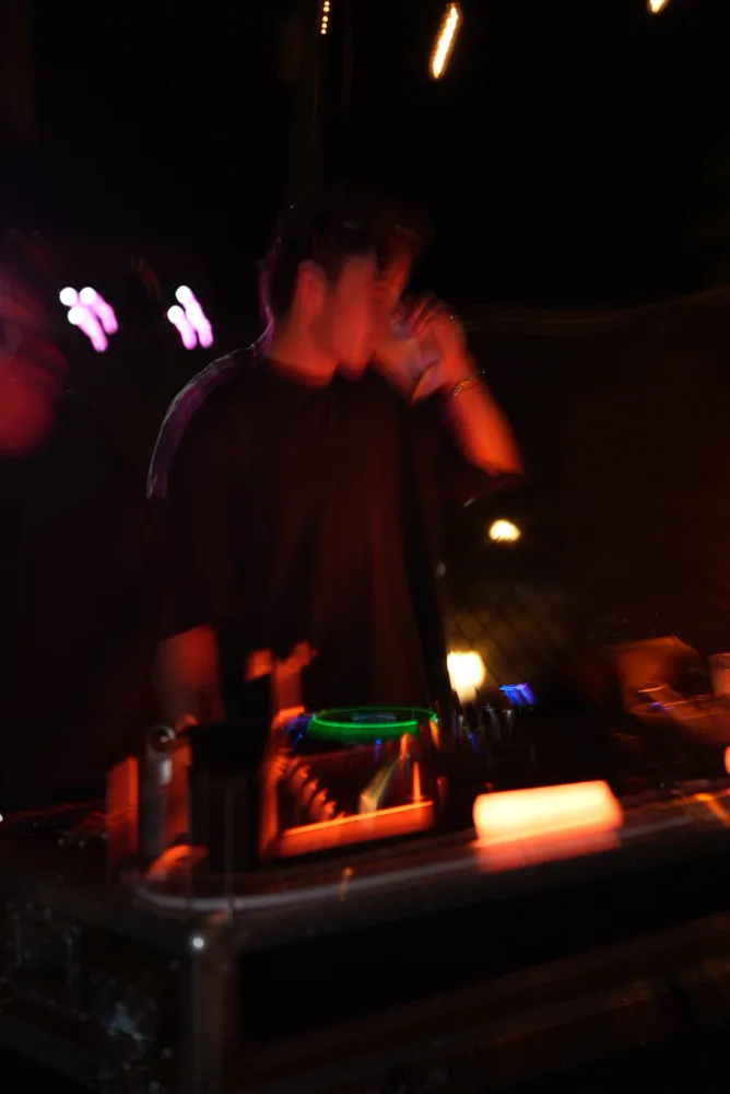 Motion-blurred performance silhouette in warm light