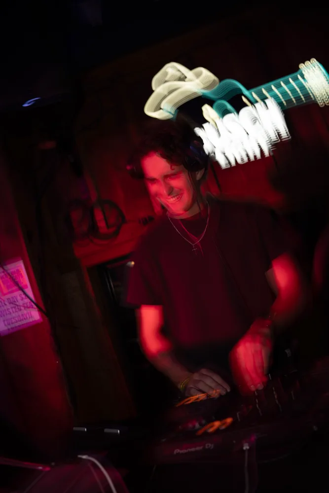 Angled performance photograph under red light