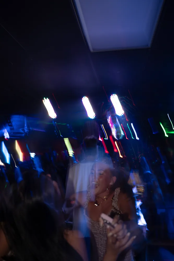 Moving venue lights above the DJ booth