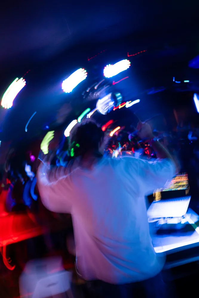 Rear booth view with blue and white light trails